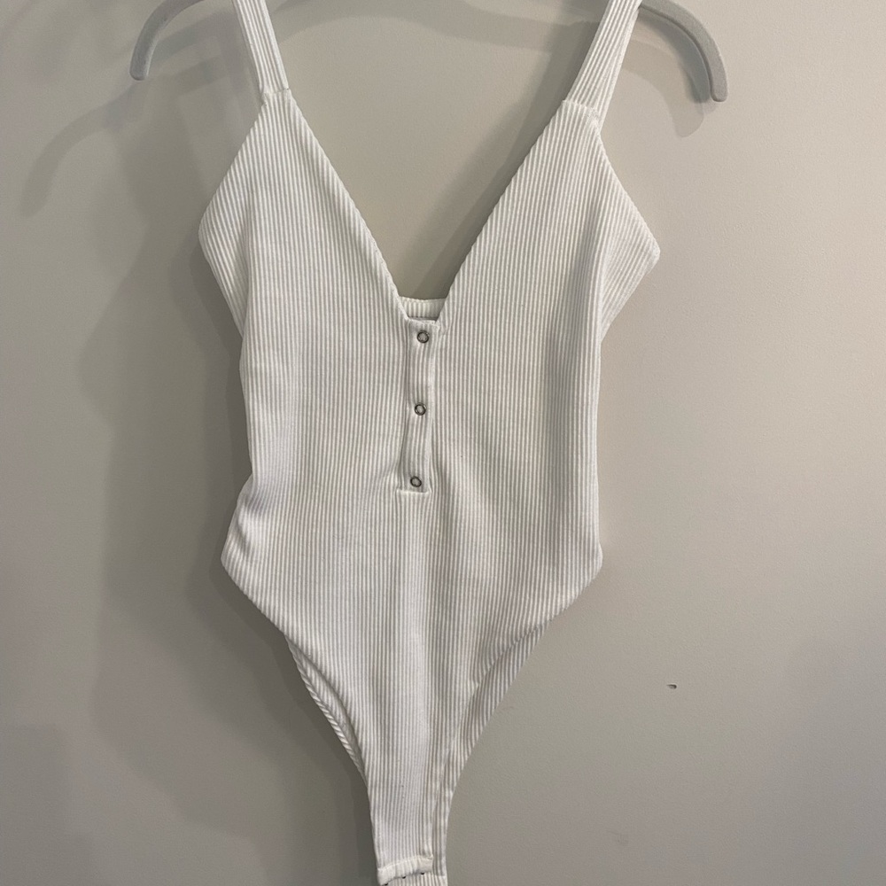 White Bodysuit with Plunging V-Neck and Button Detail | Tiger Mist
